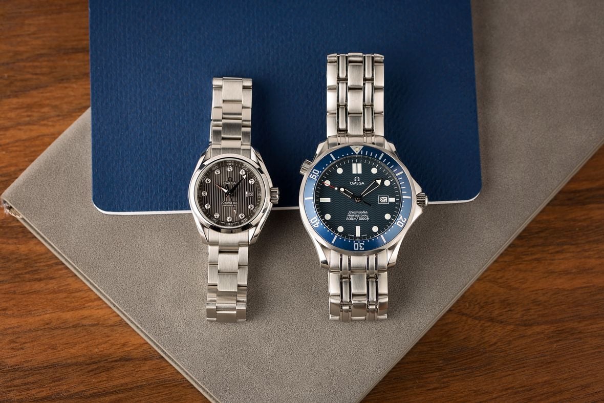 A couple of watches on a table Description automatically generated with medium confidence