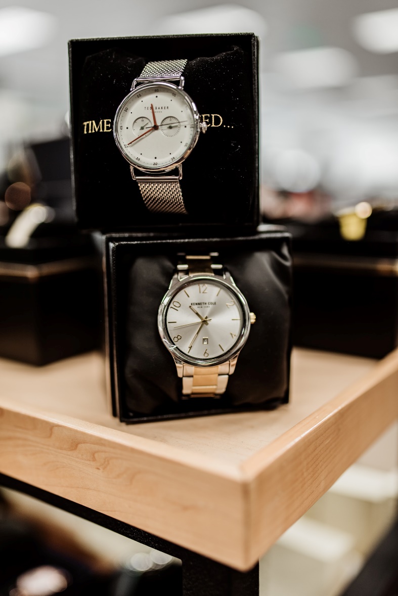 A couple of watches on a table Description automatically generated with medium confidence