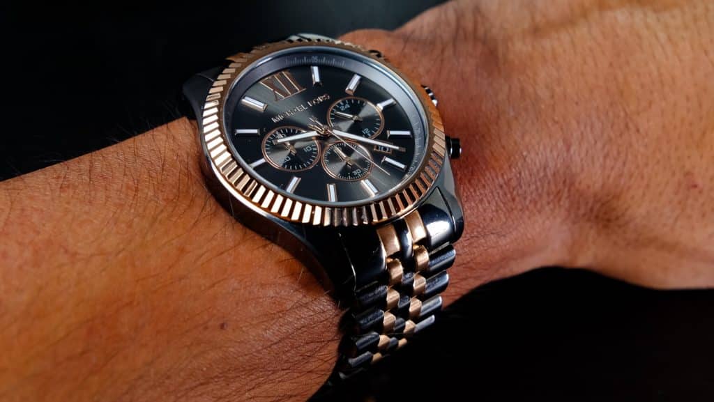 A watch on a wrist Description automatically generated with medium confidence